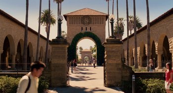 Movie still from “High School Musical 3: Senior Year” (2008), directed by Kenny Ortega – People are walking on a path near a building; Extreme Wide shot, High angle