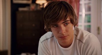 Movie still from “High School Musical 3: Senior Year” (2008), directed by Kenny Ortega – A young man with long brown hair; Close Up shot, Over the shoulder angle