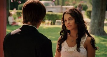 Movie still from “High School Musical 3: Senior Year” (2008), directed by Kenny Ortega – A young man and a young woman in formal wear; Close Up shot, Over the shoulder angle