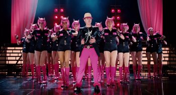 Movie still from “High School Musical 3: Senior Year” (2008), directed by Kenny Ortega – A group of people dressed in pink and pink boots; Wide shot, Low angle