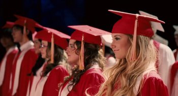 Movie still from “High School Musical 3: Senior Year” (2008), directed by Kenny Ortega – A group of women in graduation caps and gowns; Close Up shot, Low angle