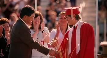 Movie still from “High School Musical 3: Senior Year” (2008), directed by Kenny Ortega – A group of people that are shaking hands; Medium shot, Over the shoulder angle
