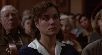 Movie still from “Hoosiers” (1986), directed by David Anspaugh – A person wearing a sweater; Close Up shot, High angle