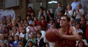 Movie still from “Hoosiers” (1986), directed by David Anspaugh – A crowd of people watching a basketball game in progress; Medium shot, Low angle