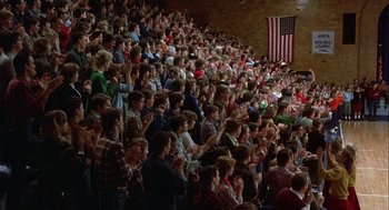 Movie still from “Hoosiers” (1986), directed by David Anspaugh – A large crowd of people in a stadium; Extreme Wide shot, High angle