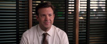 Movie still from “Horrible Bosses” (2011), directed by Seth Gordon – A person wearing a shirt and tie; Close Up shot, Over the shoulder angle