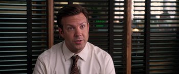 Movie still from “Horrible Bosses” (2011), directed by Seth Gordon – A person wearing a shirt and a tie; Close Up shot, Over the shoulder angle