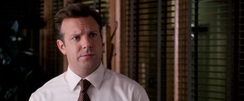 Movie still from “Horrible Bosses” (2011), directed by Seth Gordon – A person wearing a shirt and tie; Close Up shot, Over the shoulder angle