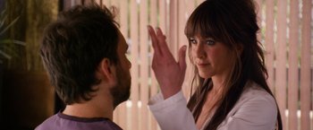 Movie still from “Horrible Bosses” (2011), directed by Seth Gordon – A man and a woman standing next to each other; Close Up shot, Over the shoulder angle