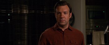 Movie still from “Horrible Bosses” (2011), directed by Seth Gordon – A person wearing a brown shirt; Close Up shot, Over the shoulder angle