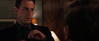 Movie still from “Horrible Bosses” (2011), directed by Seth Gordon – A person wearing a suit and tie; Close Up shot, Over the shoulder angle