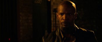 Movie still from “Horrible Bosses” (2011), directed by Seth Gordon – A person wearing a leather jacket; Close Up shot, Over the shoulder angle