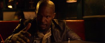 Movie still from “Horrible Bosses” (2011), directed by Seth Gordon – A man sitting at a table in a restaurant; Close Up shot, Over the shoulder angle