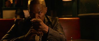 Movie still from “Horrible Bosses” (2011), directed by Seth Gordon – A man sitting down with a cigarette in his mouth; Close Up shot, Over the shoulder angle