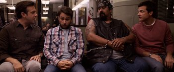 Movie still from “Horrible Bosses” (2011), directed by Seth Gordon – Two men sitting next to each other on a train; Medium shot, Over the shoulder angle