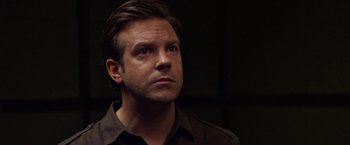 Movie still from “Horrible Bosses” (2011), directed by Seth Gordon – A person wearing a brown shirt; Close Up shot, Over the shoulder angle