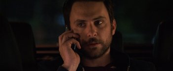 Movie still from “Horrible Bosses” (2011), directed by Seth Gordon – A person talking on a cell phone; Close Up shot, High angle