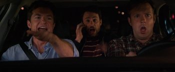 Movie still from “Horrible Bosses” (2011), directed by Seth Gordon – A man on a cell phone in a car; Medium shot, High angle