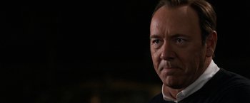 Movie still from “Horrible Bosses” (2011), directed by Seth Gordon – A person wearing a black shirt; Close Up shot, Over the shoulder angle