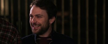 Movie still from “Horrible Bosses” (2011), directed by Seth Gordon – A person with a beard smiling; Close Up shot, Over the shoulder angle