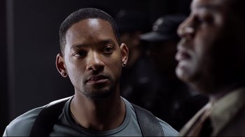 Movie still from “I, Robot” (2004), directed by Alex Proyas – A person wearing a hat; Close Up shot, Over the shoulder angle