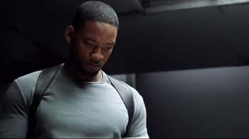 Movie still from “I, Robot” (2004), directed by Alex Proyas – A person wearing a gray shirt; Close Up shot, Low angle