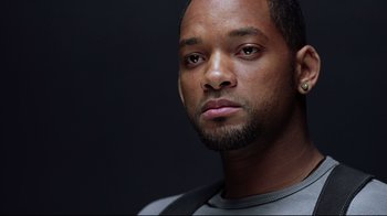 Movie still from “I, Robot” (2004), directed by Alex Proyas – A person with a beard; Close Up shot, Over the shoulder angle