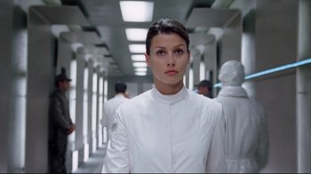 Movie still from “I, Robot” (2004), directed by Alex Proyas – A woman in a lab coat standing in a hallway; Close Up shot, Low angle