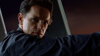 Movie still from “I, Robot” (2004), directed by Alex Proyas – A person wearing a black jacket; Close Up shot, Low angle