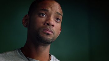 Movie still from “I, Robot” (2004), directed by Alex Proyas – A person with a piercing on his ear; Close Up shot, Low angle