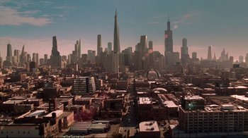 Movie still from “I, Robot” (2004), directed by Alex Proyas – An aerial view of a large city with skyscrapers; Extreme Wide shot, High angle