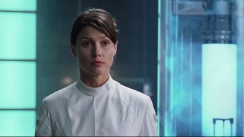 Movie still from “I, Robot” (2004), directed by Alex Proyas – A woman wearing a white shirt and a white jacket; Close Up shot, Over the shoulder angle