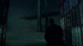 Movie still from “I, Robot” (2004), directed by Alex Proyas – A man standing in front of a bridge at night; Extreme Wide shot, Low angle
