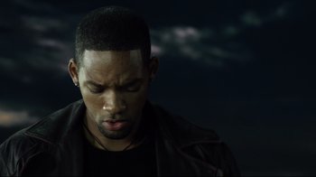 Movie still from “I, Robot” (2004), directed by Alex Proyas – A person wearing a black jacket; Close Up shot, High angle