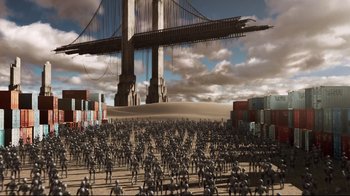 Movie still from “I, Robot” (2004), directed by Alex Proyas – A large group of people standing in front of a bridge; Extreme Wide shot, High angle