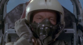 Movie still from “Hot Shots!” (1991), directed by Jim Abrahams – A person wearing a helmet; Close Up shot, Overhead angle