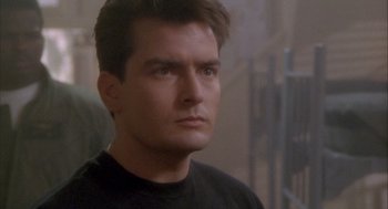 Movie still from “Hot Shots!” (1991), directed by Jim Abrahams – A man that is staring at something; Close Up shot, Low angle