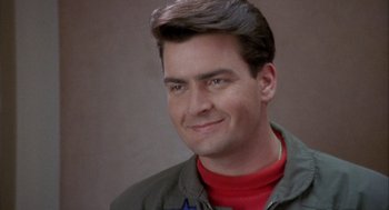 Movie still from “Hot Shots!” (1991), directed by Jim Abrahams – A person wearing a jacket; Close Up shot, Low angle