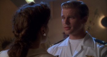 Movie still from “Hot Shots!” (1991), directed by Jim Abrahams – A man and a woman are looking at each other; Close Up shot, Over the shoulder angle