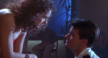 Movie still from “Hot Shots!” (1991), directed by Jim Abrahams – A man and a woman talking to each other; Medium shot, Over the shoulder angle