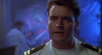 Movie still from “Hot Shots!” (1991), directed by Jim Abrahams – A person wearing a uniform; Close Up shot, Low angle