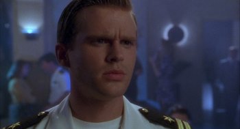 Movie still from “Hot Shots!” (1991), directed by Jim Abrahams – A person wearing a uniform; Close Up shot, Over the shoulder angle