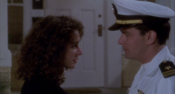 Movie still from “Hot Shots!” (1991), directed by Jim Abrahams – A man and a woman are looking at each other; Close Up shot, Low angle