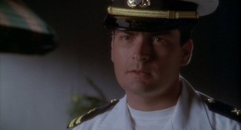 Movie still from “Hot Shots!” (1991), directed by Jim Abrahams – A person wearing a uniform; Close Up shot, Low angle