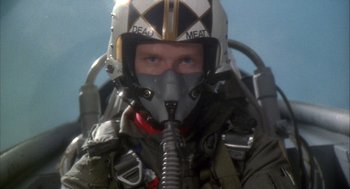 Movie still from “Hot Shots!” (1991), directed by Jim Abrahams – A man in a fighter pilot's helmet and mask; Close Up shot, Low angle