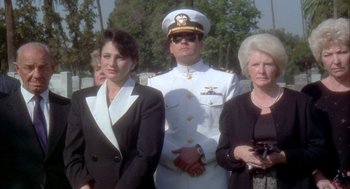 Movie still from “Hot Shots!” (1991), directed by Jim Abrahams – Two women and a man in a military uniform; Medium shot, Low angle