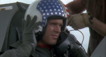 Movie still from “Hot Shots!” (1991), directed by Jim Abrahams – A man wearing a helmet with stars on it; Close Up shot, Low angle