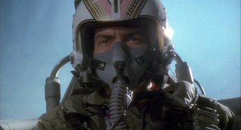 Movie still from “Hot Shots!” (1991), directed by Jim Abrahams – A person wearing a pilot's helmet; Close Up shot, Low angle
