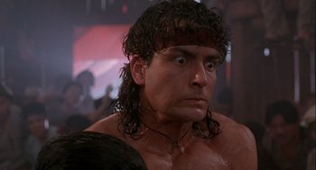 Movie still from “Hot Shots! Part Deux” (1993), directed by Jim Abrahams – A person with long hair; Close Up shot, Low angle