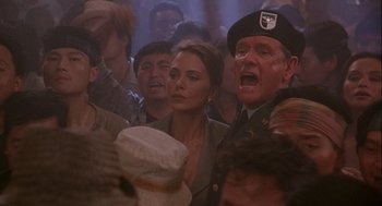 Movie still from “Hot Shots! Part Deux” (1993), directed by Jim Abrahams – A group of people standing in a room; Close Up shot, Low angle